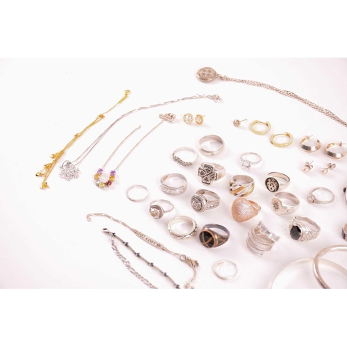 38 - A collection of silver and white metal jewellery including a CZ cluster ring hallmarked as '925', a ... 