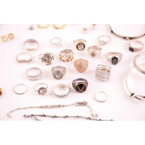 38 - A collection of silver and white metal jewellery including a CZ cluster ring hallmarked as '925', a ... 