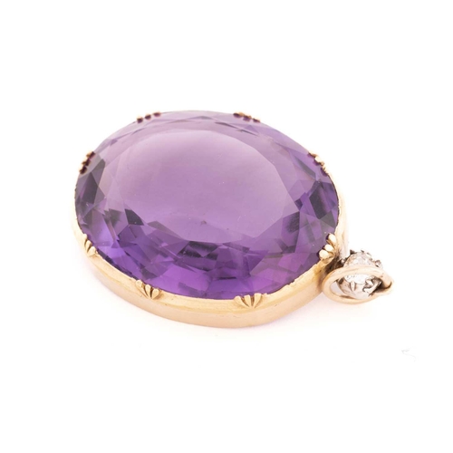 4 - A large amethyst and diamond pendant, featuring an oval mixed-cut amethyst, approximately measuring ... 