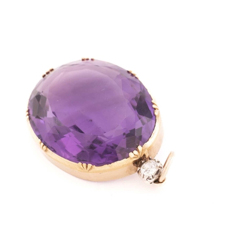 4 - A large amethyst and diamond pendant, featuring an oval mixed-cut amethyst, approximately measuring ... 