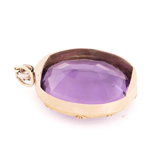 4 - A large amethyst and diamond pendant, featuring an oval mixed-cut amethyst, approximately measuring ... 