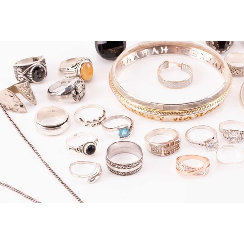 40 - A collection of silver and white metal jewellery; to include examples of a single Cartier cufflink, ... 