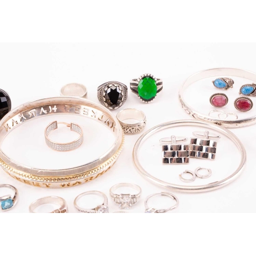 40 - A collection of silver and white metal jewellery; to include examples of a single Cartier cufflink, ... 