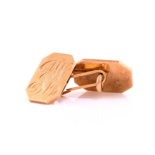 45 - A pair of 18 carat gold cufflinks in an associated Boucheron cufflink box. the rectangular cut-corne... 