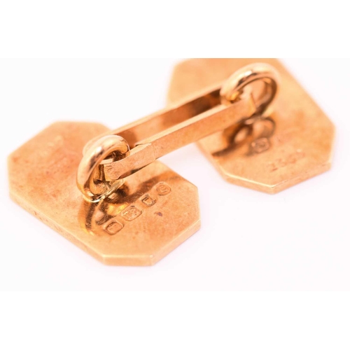 45 - A pair of 18 carat gold cufflinks in an associated Boucheron cufflink box. the rectangular cut-corne... 