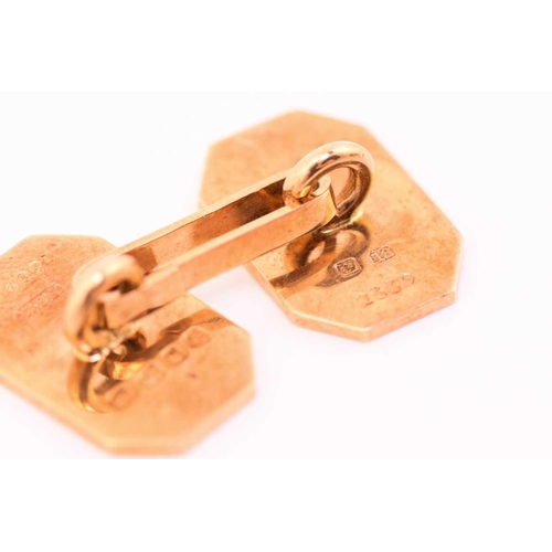 45 - A pair of 18 carat gold cufflinks in an associated Boucheron cufflink box. the rectangular cut-corne... 