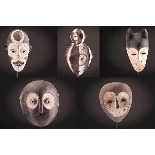100 - A Lage Bwami society mask, Democratic Republic of Congo, painted in white and earthy pigments28.5cm;... 