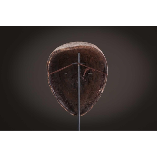 100 - A Lage Bwami society mask, Democratic Republic of Congo, painted in white and earthy pigments28.5cm;... 