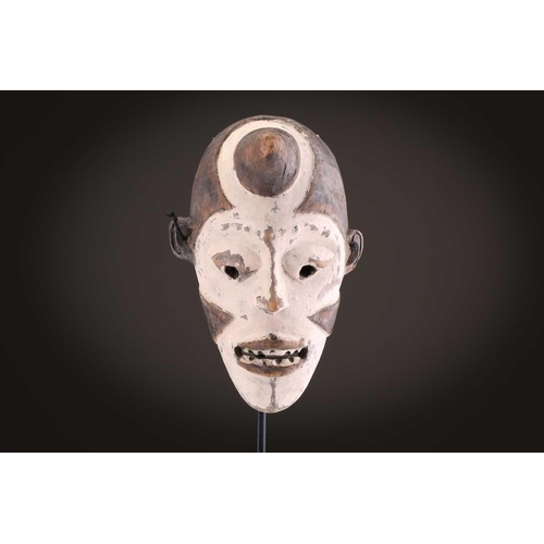 100 - A Lage Bwami society mask, Democratic Republic of Congo, painted in white and earthy pigments28.5cm;... 