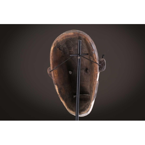 100 - A Lage Bwami society mask, Democratic Republic of Congo, painted in white and earthy pigments28.5cm;... 