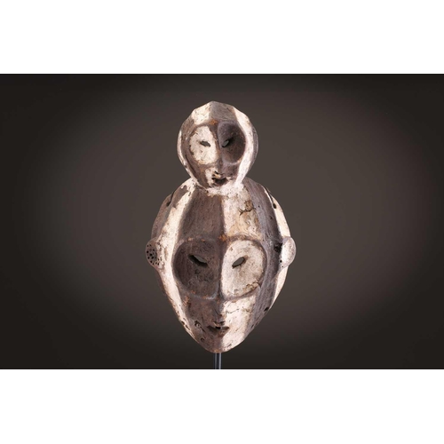 100 - A Lage Bwami society mask, Democratic Republic of Congo, painted in white and earthy pigments28.5cm;... 