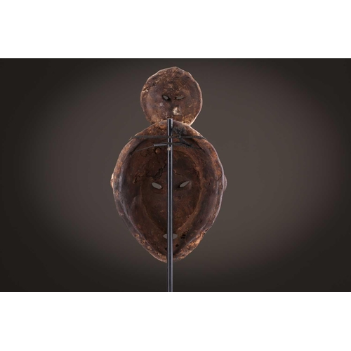 100 - A Lage Bwami society mask, Democratic Republic of Congo, painted in white and earthy pigments28.5cm;... 
