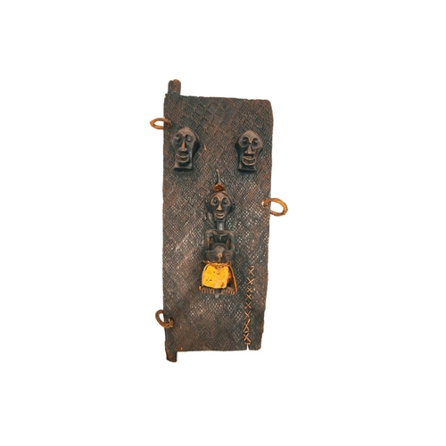 101 - A Songye door, Democratic Republic of Congo, with two relieved carved face masks above a standing (N... 