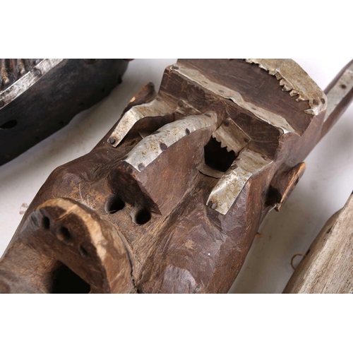102 - Two Marka masks, Mali, each of zoomorphic form, with applied strips of aluminium, the monkey form ma... 