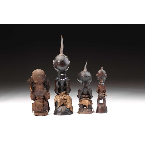 103 - Four Songye power figures, Nikisi, Democratic Republic of Congo, three with animal horn charge, with... 