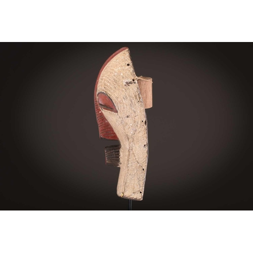 105 - Three Luba Bilume kifwebe, Democratic Republic of Congo, a hardwood example with incised linear deco... 
