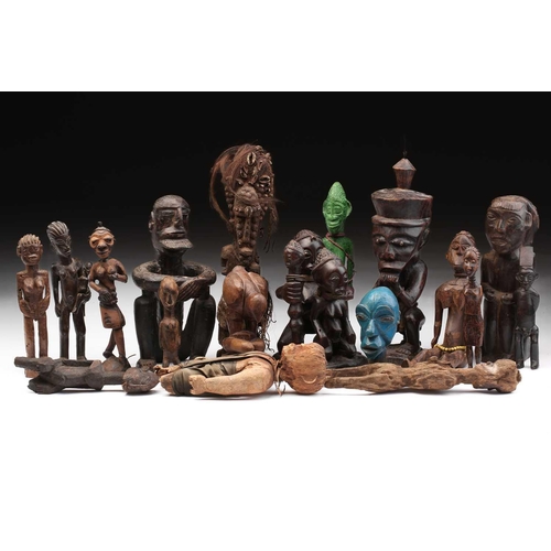109 - A collection of eighteen principally West African seated and standing figures, to include a Bambara ... 