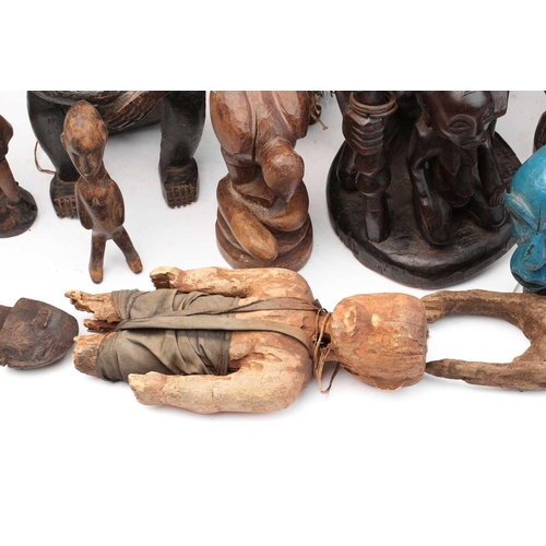 109 - A collection of eighteen principally West African seated and standing figures, to include a Bambara ... 