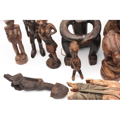 109 - A collection of eighteen principally West African seated and standing figures, to include a Bambara ... 