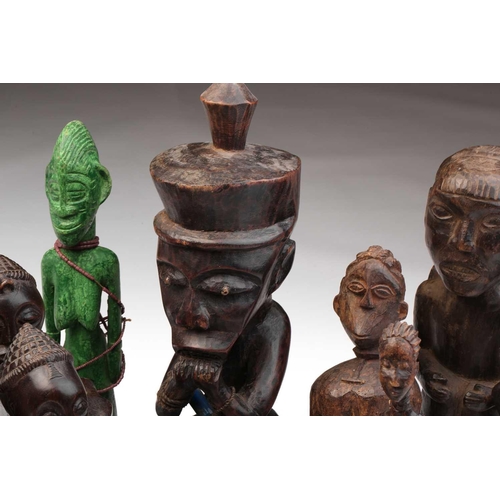 109 - A collection of eighteen principally West African seated and standing figures, to include a Bambara ... 