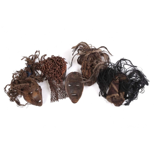 111 - A Tchokwe Pwo mask, Angola, with cross hatched coiffure, with facial scarifications, the pierced sid... 