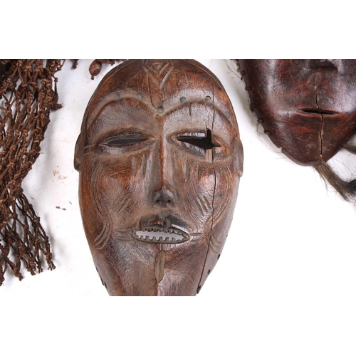 111 - A Tchokwe Pwo mask, Angola, with cross hatched coiffure, with facial scarifications, the pierced sid... 