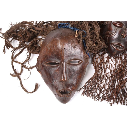 111 - A Tchokwe Pwo mask, Angola, with cross hatched coiffure, with facial scarifications, the pierced sid... 