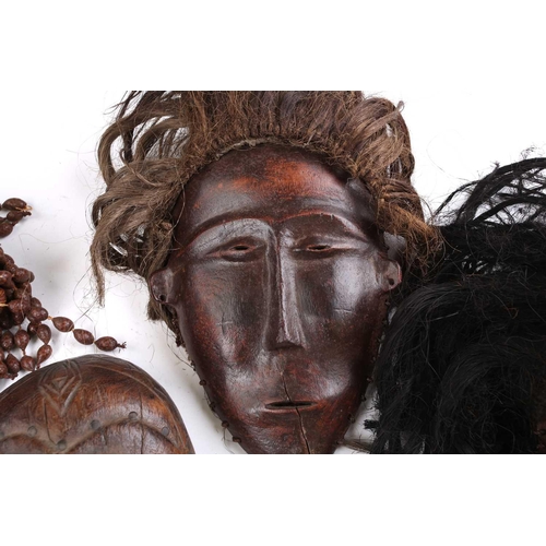 111 - A Tchokwe Pwo mask, Angola, with cross hatched coiffure, with facial scarifications, the pierced sid... 