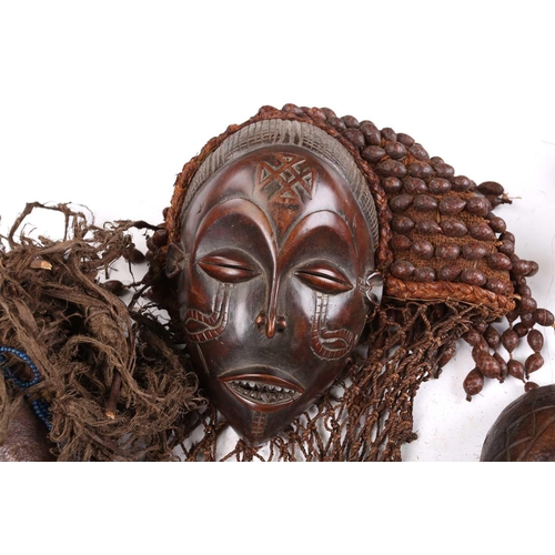 111 - A Tchokwe Pwo mask, Angola, with cross hatched coiffure, with facial scarifications, the pierced sid... 