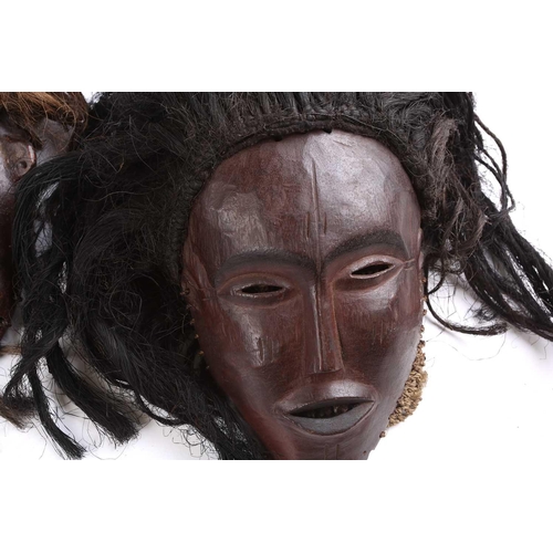 111 - A Tchokwe Pwo mask, Angola, with cross hatched coiffure, with facial scarifications, the pierced sid... 