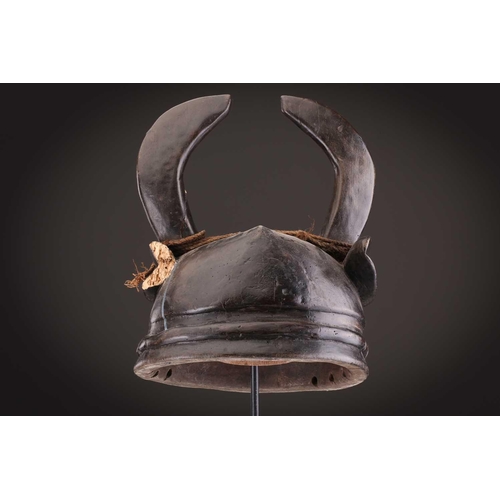 112 - A Mambila zoomorphic headdress mask, Cameroon, covered in animal skin, with wood teeth and red pigme... 