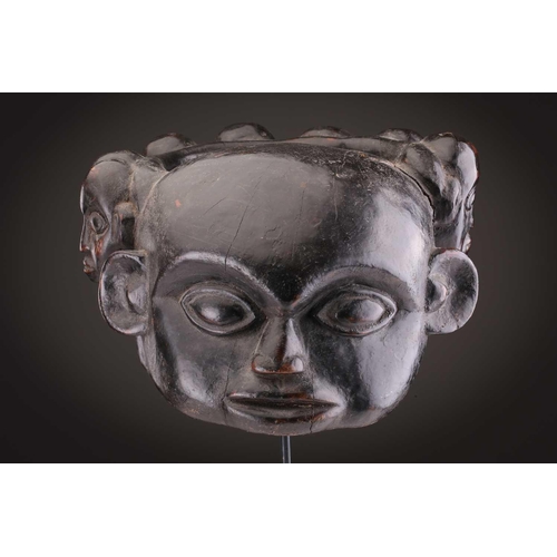 112 - A Mambila zoomorphic headdress mask, Cameroon, covered in animal skin, with wood teeth and red pigme... 