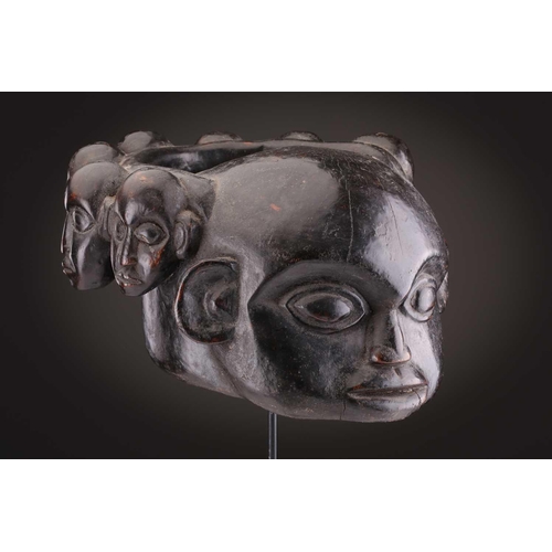 112 - A Mambila zoomorphic headdress mask, Cameroon, covered in animal skin, with wood teeth and red pigme... 