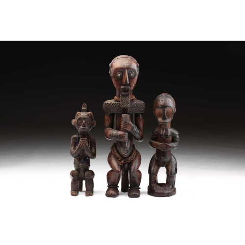 116 - A Fang male figure, Bieri, Gabon, decorated throughout with embossed brass strips, the eyes inset wi... 