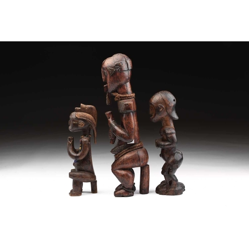 116 - A Fang male figure, Bieri, Gabon, decorated throughout with embossed brass strips, the eyes inset wi... 