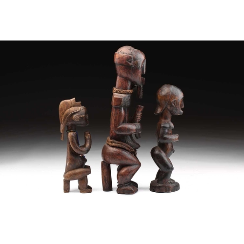 116 - A Fang male figure, Bieri, Gabon, decorated throughout with embossed brass strips, the eyes inset wi... 