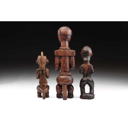 116 - A Fang male figure, Bieri, Gabon, decorated throughout with embossed brass strips, the eyes inset wi... 