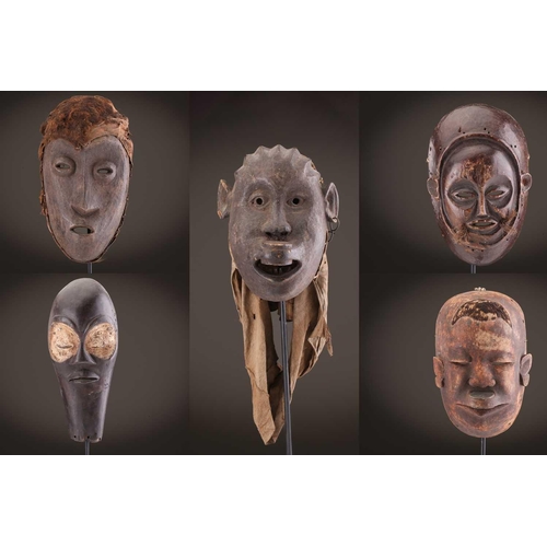 118 - A Lombi mask, Democratic Republic of Congo, the eye sockets painted with thick white pigment, 40cm, ... 
