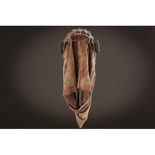 118 - A Lombi mask, Democratic Republic of Congo, the eye sockets painted with thick white pigment, 40cm, ... 