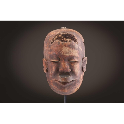 118 - A Lombi mask, Democratic Republic of Congo, the eye sockets painted with thick white pigment, 40cm, ... 