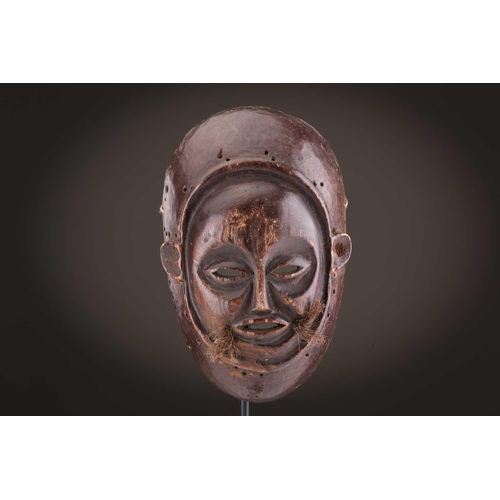 118 - A Lombi mask, Democratic Republic of Congo, the eye sockets painted with thick white pigment, 40cm, ... 