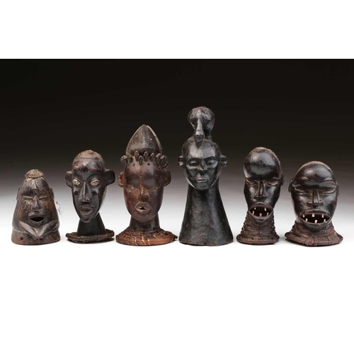 119 - Five Ekoi anthropomorphic head crests, Nigeria, four with applied hair, and a solid head crest with ... 