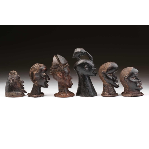 119 - Five Ekoi anthropomorphic head crests, Nigeria, four with applied hair, and a solid head crest with ... 