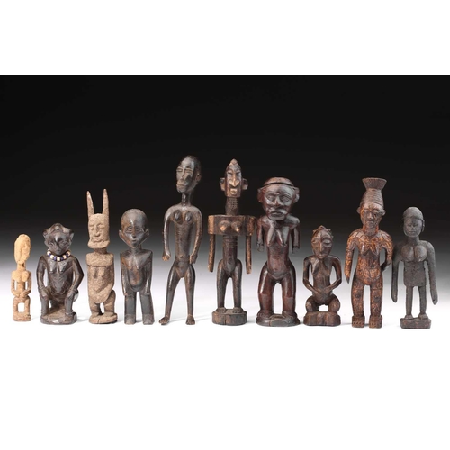 20 - A Dogon hemaphroditic standing figure, Mali, 38cm; two further Dogon female figures, one with horns ... 