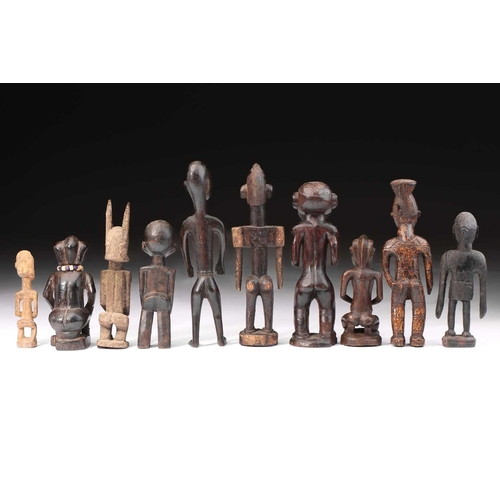 20 - A Dogon hemaphroditic standing figure, Mali, 38cm; two further Dogon female figures, one with horns ... 