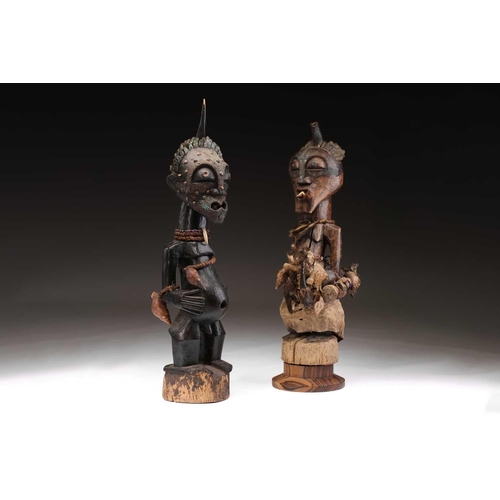 62 - Two Songye community power figures, Mankisi, with horn charge and embedded metal blades to the head,... 