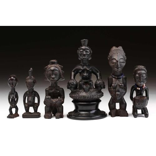 64 - A Luba anthropomorphic medicine pot, Democratic Republic of Congo, carved as a seated female figure ... 