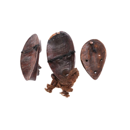 65 - A group of nine Dan masks, Liberia, to include two bird masks and three passport masks, 12.5cm - 32c... 