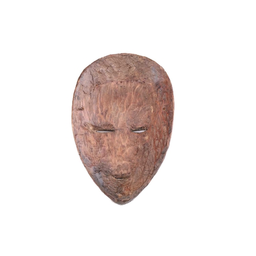 65 - A group of nine Dan masks, Liberia, to include two bird masks and three passport masks, 12.5cm - 32c... 