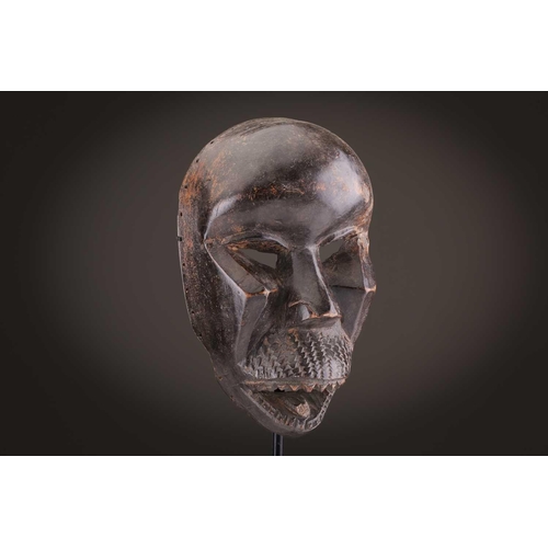 65 - A group of nine Dan masks, Liberia, to include two bird masks and three passport masks, 12.5cm - 32c... 